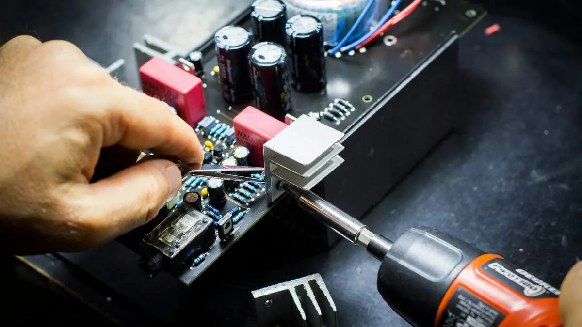 Technician repairing laptop internals for Alexandria home and business computer repair in Northern Virginia
