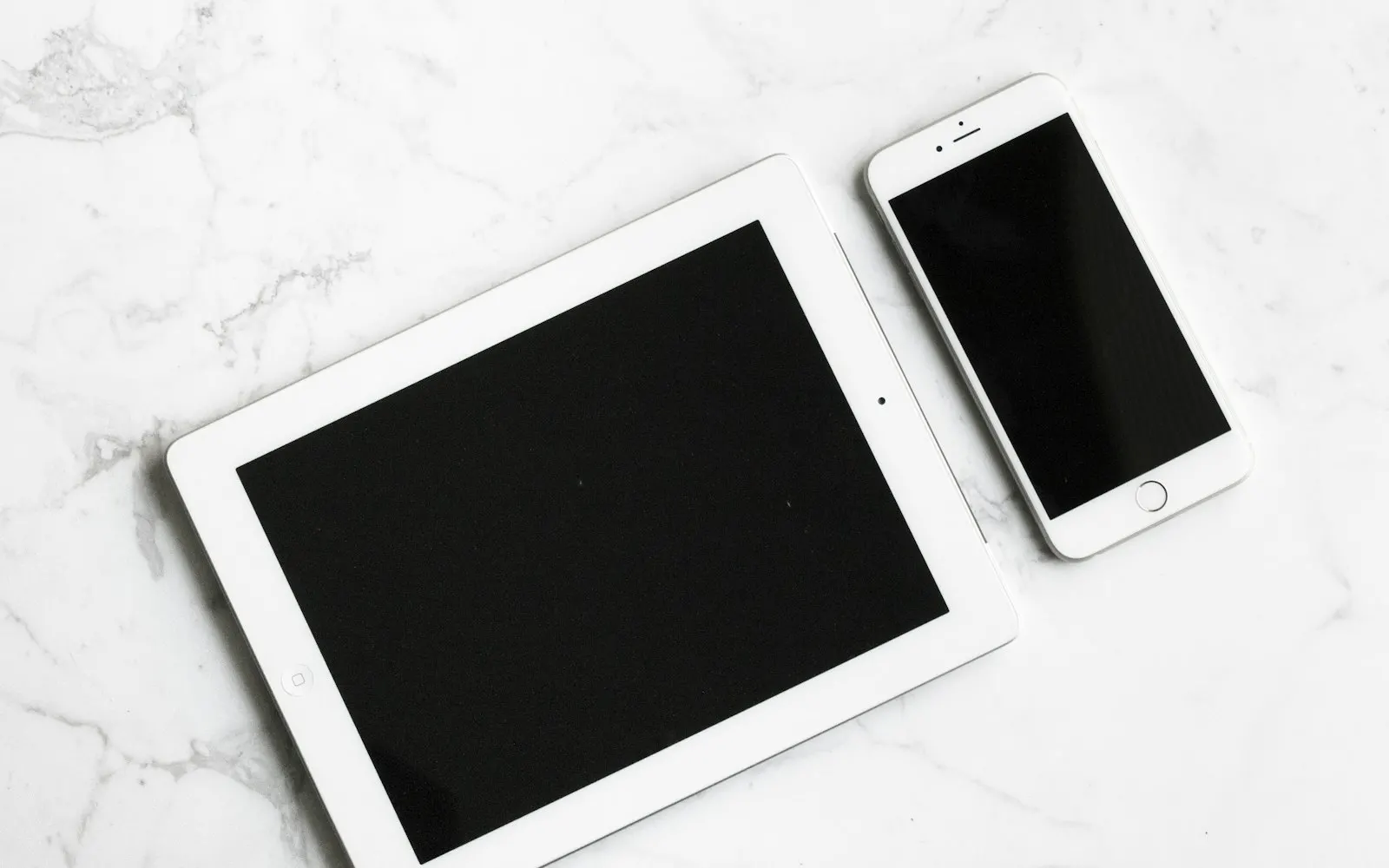 Smartphone and tablet on a desk