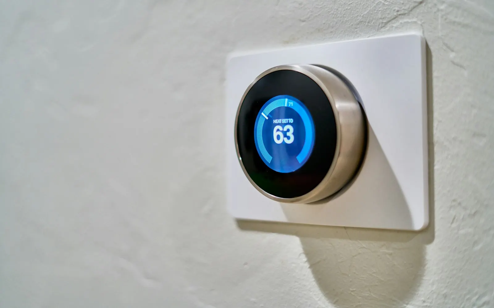 Smart thermostat on a wall