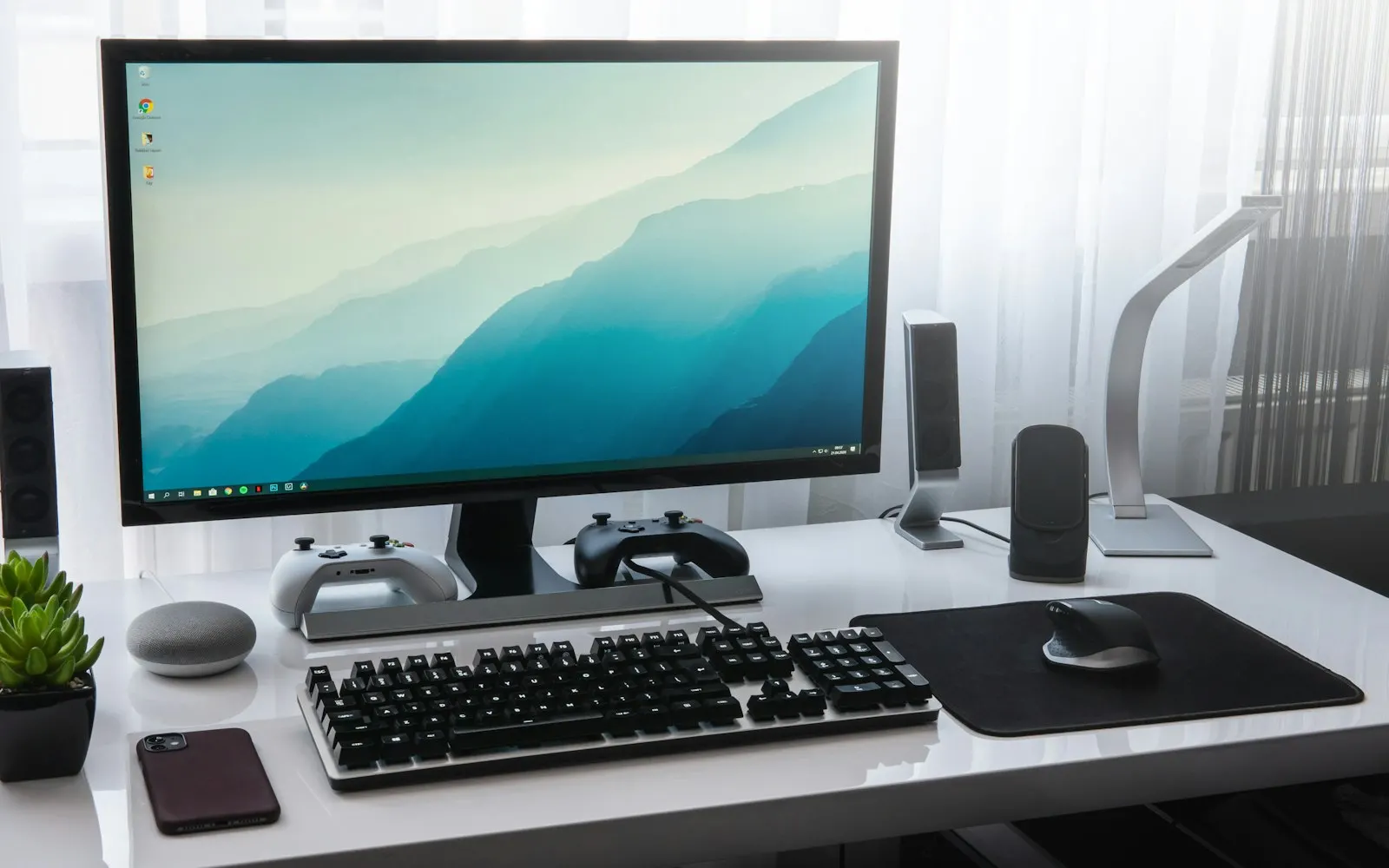 Desk setup with monitor, keyboard and mouse