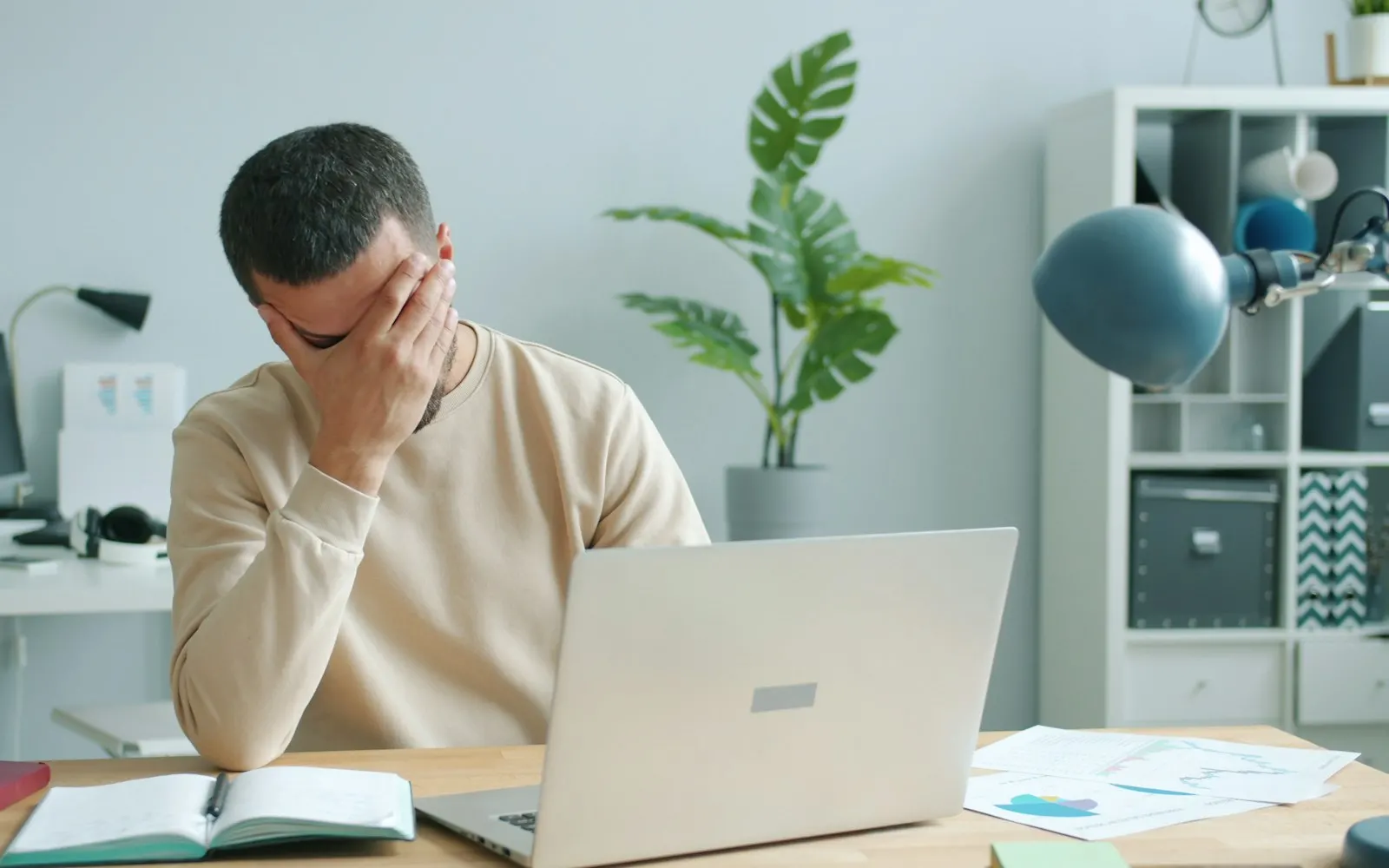 Frustrated user waiting on a slow laptop