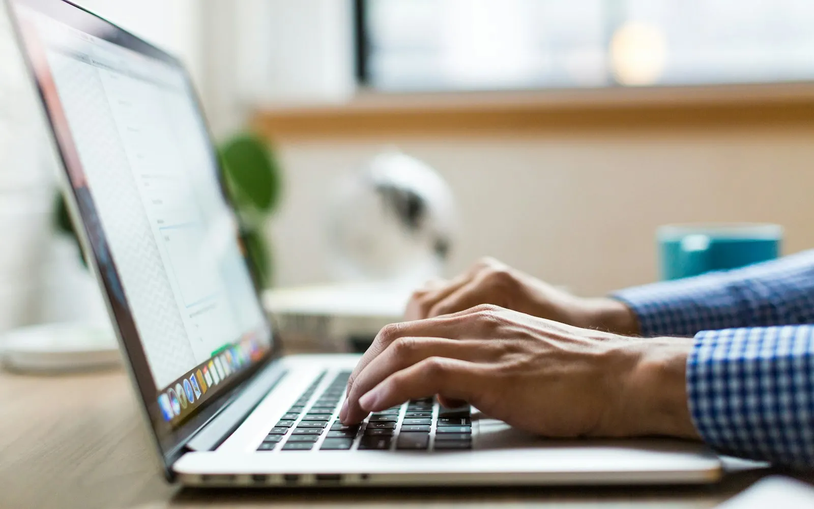 Person installing software on a laptop