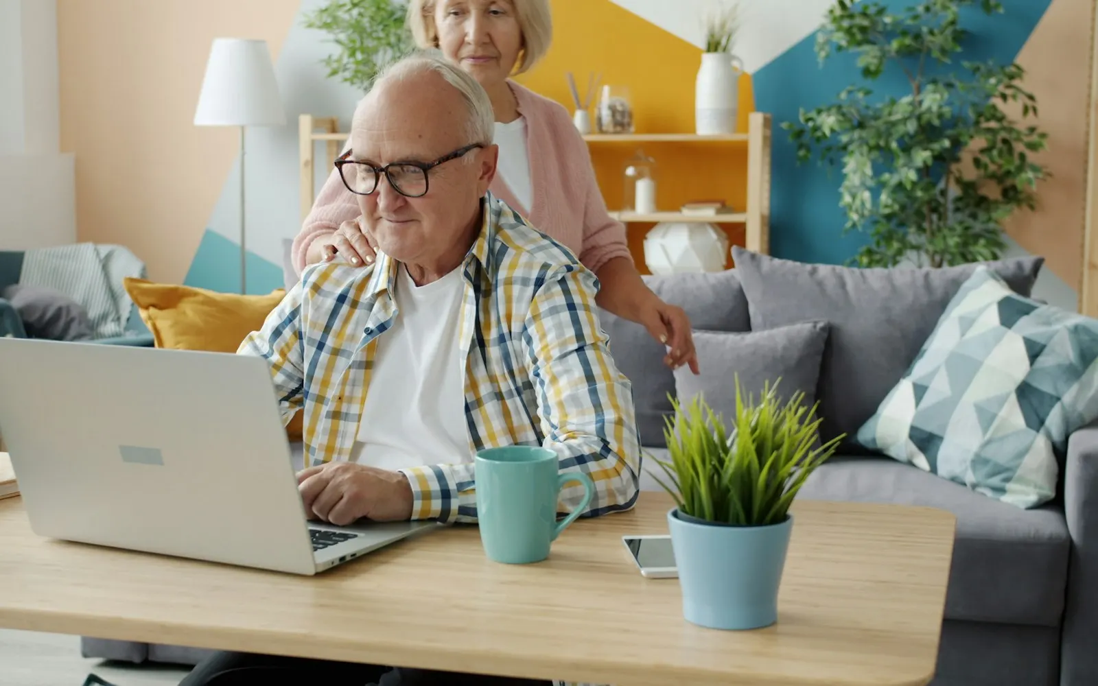 Senior learning to use a laptop at home