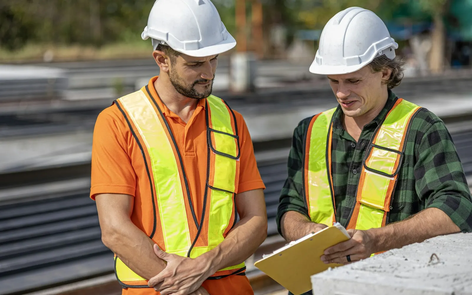 Construction team reviewing plans on a tablet