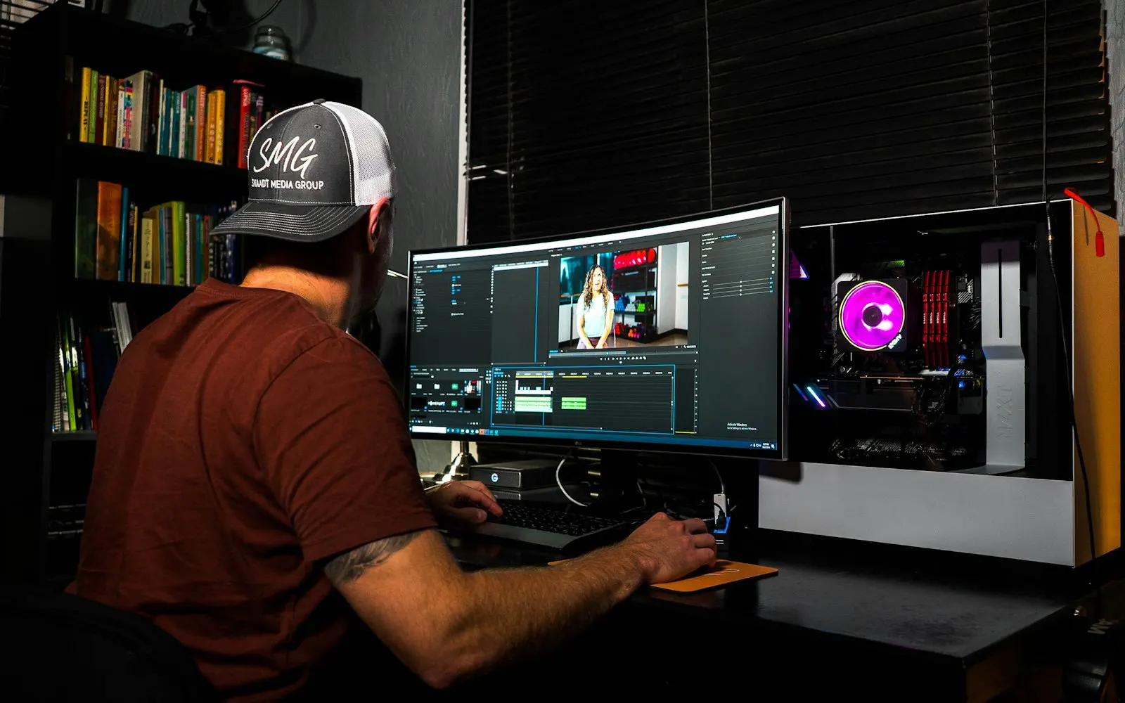 Content creator editing video at a workstation