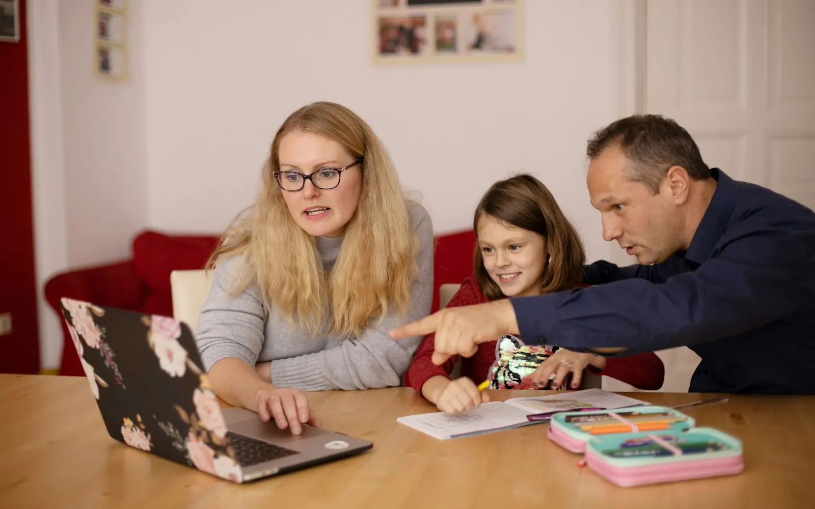 Family using a laptop together at home