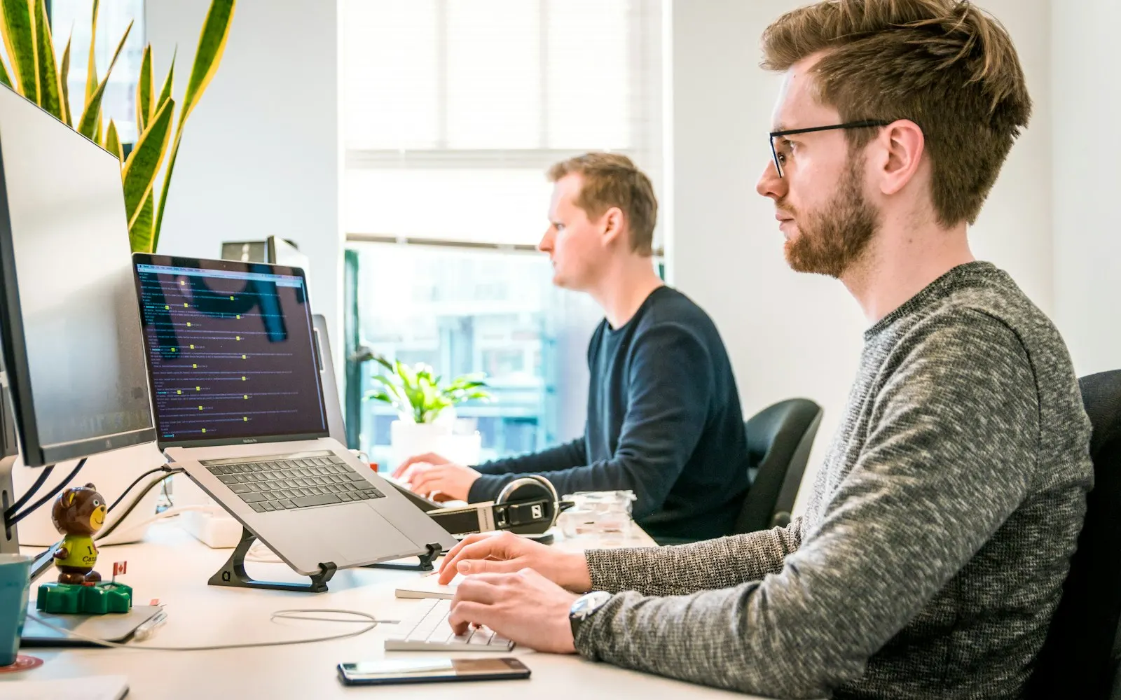 Professionals working at office computers